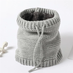 Detail of grey knitted neck warmer featuring plush fleece lining and adjustable drawstring