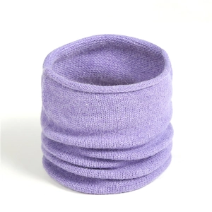 Close-up detail of soft light purple knitted neck warmer with fine ribbed texture