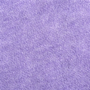 Macro shot of soft light purple knitted fabric texture showing premium yarn details