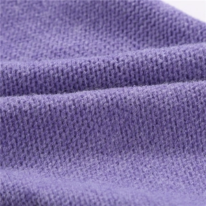 Close-up of purple knitted scarf texture showing premium wool blend fabric details