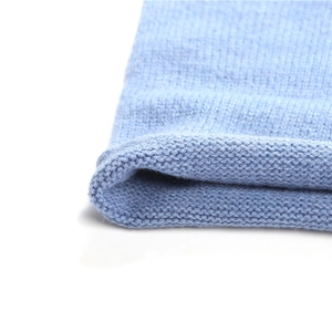 Macro shot showing the ribbed knit texture and soft blue yarn fibers of the winter neck warmer