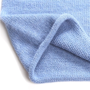 Light blue knitted neck warmer scarf with soft ribbed texture for winter warmth