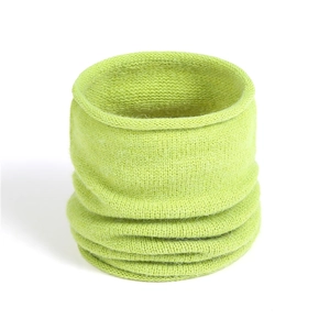 Detail of bright green ribbed knit neck warmer showing soft texture and high-quality yarn