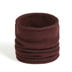 Close-up of soft knit wine red infinity scarf showing detailed wool texture and stitching