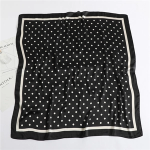 Detailed top view of 90cm square black polka dot silk scarf with elegant satin finish