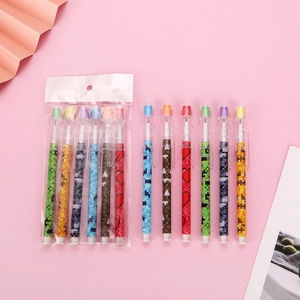 Colorful mosaic pattern stackable pencils with caps on a soft pink background