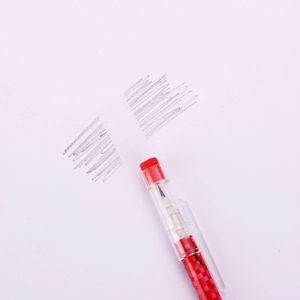 Close-up of red and white checkered mechanical pencil with built-in eraser on top