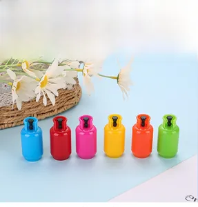 Detail of creative gas cylinder shaped retractable ballpoint pens in six vibrant colors