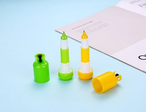 Detail of creative gas canister shaped ballpoint pens in yellow and green colors