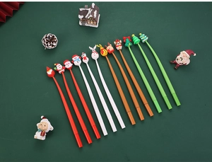 Flat lay of 12 Christmas silicone gel pens with Santa, snowman, and reindeer toppers