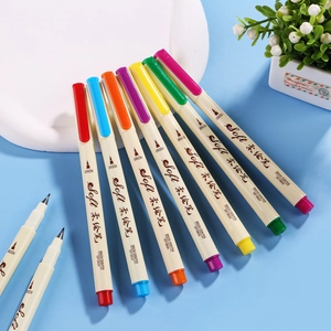 Multi-color soft brush sign pens for calligraphy and drawing on a light blue background
