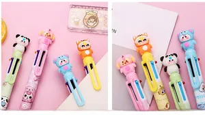 Détail de stylos multicolores rétractables avec poupées 3D et clips de fixation