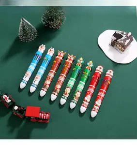 Macro detail of Christmas multi-color ballpoint pens with cute cartoon toppers and motifs