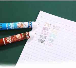 Close-up of 10-color Christmas ballpoint pen showing multi-color ink writing samples
