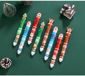 Close-up of Christmas Capybara 10-color ballpoint pens with cartoon holiday toppers