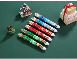 Detailed view of Christmas multi-color pens with 3D Santa and snowman character toppers