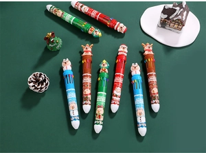 Detailed top view of 10-color Christmas ballpoint pens with silicone cartoon toppers