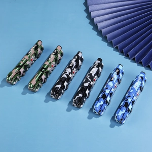 Creative missile launcher pens in camo green, black gray, and navy blue camo patterns