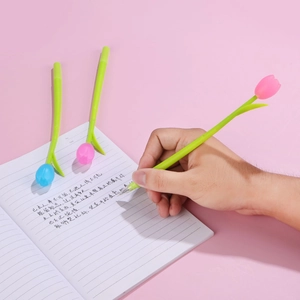 Detailed view of hand writing with a tulip flower silicone gel pen in soft pink and green