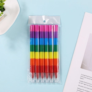 Flat lay of rainbow stackable building block crayons in transparent packaging