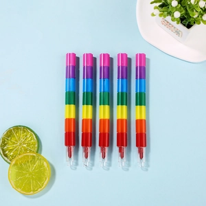 Macro shot of stackable rainbow crayons featuring eight modular colors for creative drawing
