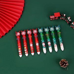 Close-up of Christmas 10-color pens with reindeer and snowman designs on festive background