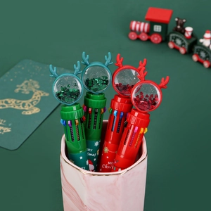 Detail of Christmas multi-color ballpoint pens with sequin globe and reindeer antlers