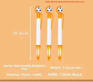 Close-up of three orange retractable ballpoint pens with a rotating football design