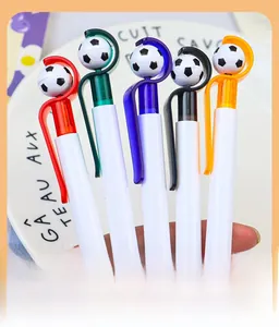 Detail of five retractable soccer ball pens with vibrant colored clips for student gifts