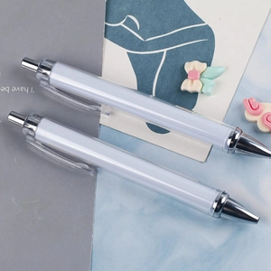 Minimalist white retractable ballpoint pens with silver tips and transparent clips