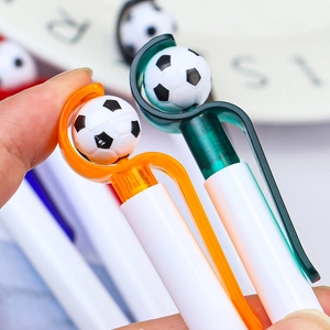 Creative soccer spinning ballpoint pen with white barrel and colorful clip accents