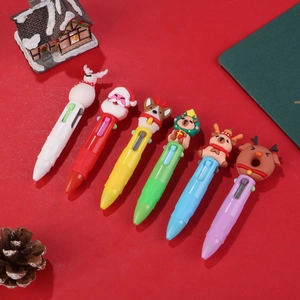 Dettaglio di confezione da 6 penne a sfera multicolore natalizie con figurine topper