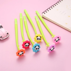 Close-up of cute floral gel pens with panda faces and green stems on pink background