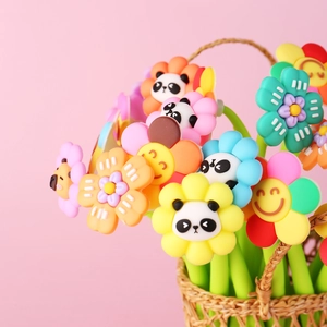 Flower-shaped pens with cute cartoon icons displayed in a small woven basket