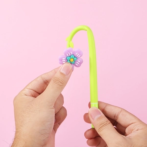 Creative floral gel pen with green curved barrel and purple flower topper decoration