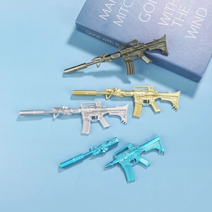 Close-up of M4A1 rifle shaped pens in bronze, gold, silver, and blue metallic finishes