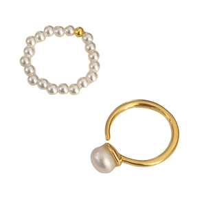 Minimalist freshwater pearl beaded ring and gold open ring set on white background