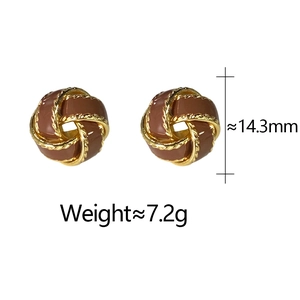 Detailed view of vintage twist stud earrings with brown enamel and gold braiding