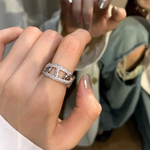 Minimalist silver pig nose open ring featuring micro-pave cubic zirconia stones