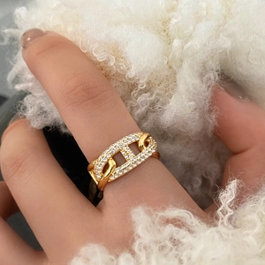 Close-up of gold plated pig nose chain ring with sparkling micro-pave white zircon stones