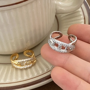 Adjustable pig-nose open ring in gold and silver finish with pavé set zircon stones