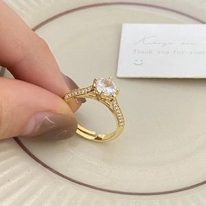 Minimalist adjustable 18K gold plated ring with a sparkling round zircon and micro-pave details