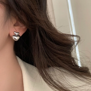 Elegant polished silver double heart stud earrings for women with a minimalist trendy design