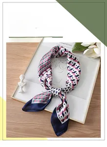 Detail of multi-color geometric 3D square pattern silk scarf with elegant satin finish