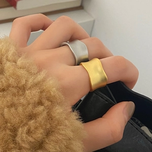 Minimalist irregular wave matte gold and silver rings for a refined aesthetic look