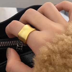 Minimalist matte gold irregular wave ring for couples with elegant satin finish design