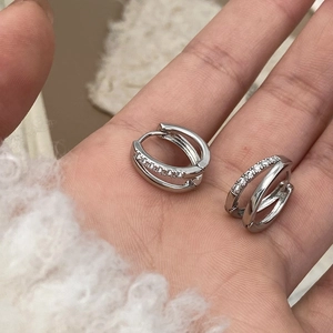 Silver micro-p镶 zircon hoop earrings with a modern double-ring crossover design