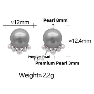 Detail of grey shell pearl earrings with white pearl fan base and micro-inlaid zircon