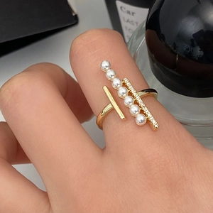 Elegant gold-plated open ring featuring parallel rows of white pearls and shimmering zircons