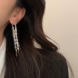 Elegant long tassel earrings with silver chains and gold beads for a minimalist look